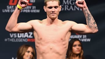 LAS VEGAS, NV - JANUARY 30: Jordan Mein steps on the scale during the UFC 183 weigh-in at the MGM Grand Garden Arena on January 30, 2015 in Las Vegas, Nevada. (Photo by Josh Hedges/Zuffa LLC/Zuffa LLC via Getty Images)