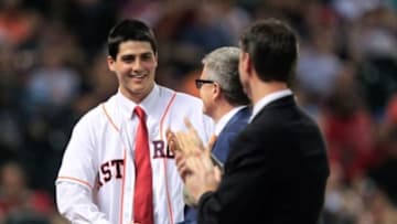 Jun 19, 2013; Houston, TX, USA; Houston Astros first overall draft pick Mark Appel shakes hands with president Reid Ryan during the fifth inning against the Milwaukee Brewers at Minute Maid Park. Mandatory Credit: Thomas Campbell-USA TODAY Sports