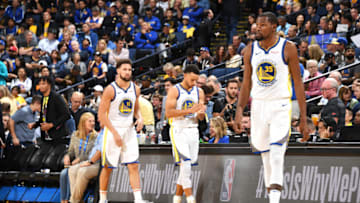 OAKLAND, CA - OCTOBER 16: Klay Thompson #11, Stephen Curry #30 and Kevin Durant #35 of the Golden State Warriors are photographed during the game against the Oklahoma City Thunder on October 16, 2018 at ORACLE Arena in Oakland, California. NOTE TO USER: User expressly acknowledges and agrees that, by downloading and or using this photograph, user is consenting to the terms and conditions of Getty Images License Agreement. Mandatory Copyright Notice: Copyright 2018 NBAE (Photo by Andrew D. Bernstein/NBAE via Getty Images)