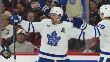 Mar 25, 2023; Raleigh, North Carolina, USA; Toronto Maple Leafs center Auston Matthews (34) celebrates his goal against the Carolina Hurricanes during the second period at PNC Arena. Mandatory Credit: James Guillory-USA TODAY Sports