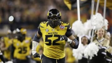 Jan 3, 2014; Arlington, TX, USA; Missouri Tigers defensive lineman Michael Sam (52) runs on the field before the game against the Oklahoma State Cowboys at the 2014 Cotton Bowl at AT&T Stadium. Missouri beat Oklahoma State 41-31. Mandatory Credit: Tim Heitman-USA TODAY Sports