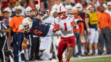 Sep 21, 2019; Champaign, IL, USA; Nebraska Cornhuskers wide receiver Wan'Dale Robinson (1) avoids an Illinois Fighting Illini tackle to run in for a touchdown during the first half at Memorial Stadium. Mandatory Credit: Patrick Gorski-USA TODAY Sports