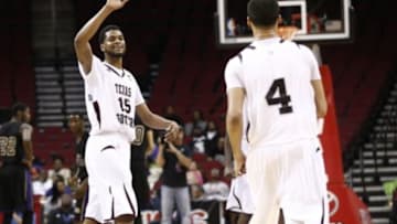Mar 15, 2014; Houston, TX, USA; Texas State Bobcats guard Nate Velasco (15) celebrates with guard Ray Dorsey (4) in the championship game against the Prairie View A&M Panthers for the SWAC Conference college basketball tournament at Toyota Center. Texas Southern won 78-73. Mandatory Credit: Jim Cowsert-USA TODAY Sports