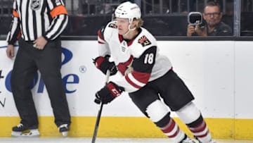 LAS VEGAS, NV - MARCH 28: Christian Dvorak #18 of the Arizona Coyotes skates with the puck against the Vegas Golden Knights during the game at T-Mobile Arena on March 28, 2018 in Las Vegas, Nevada. (Photo by David Becker/NHLI via Getty Images)