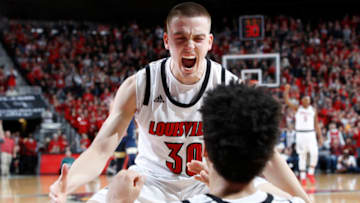 LOUISVILLE, KY - JANUARY 26: Ryan McMahon #30 and Jordan Nwora #33 of the Louisville Cardinals celebrate against the Pittsburgh Panthers in the second half of the game at KFC YUM! Center on January 26, 2019 in Louisville, Kentucky. Louisville won 66-51. (Photo by Joe Robbins/Getty Images)