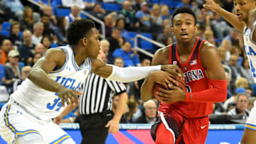 LOS ANGELES, CA - JANUARY 26: David Singleton #34 of the UCLA Bruins guards Brandon Williams #2 of the Arizona Wildcats as he drives to the basket in the second half of the game at Pauley Pavilion on January 26, 2019 in Los Angeles, California. (Photo by Jayne Kamin-Oncea/Getty Images)