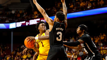 MINNEAPOLIS, MN - DECEMBER 11: Joshua Ola-Joseph #1 of the Minnesota Golden Gophers drives to the basket while Shakeel Moore #3 and Tyler Stevenson #14 of the Mississippi State Bulldogs defend in the first half of the game at Williams Arena on December 11, 2022 in Minneapolis, Minnesota. (Photo by David Berding/Getty Images)