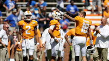 KNOXVILLE, TENNESSEE - AUGUST 31: Jarrett Guarantano #2, J.T. Shrout #12 and Brian Maurer #18 of the Tennessee Volunteers warm up before facing the Georgia State Panthers during the season opener at Neyland Stadium on August 31, 2019 in Knoxville, Tennessee. (Photo by Silas Walker/Getty Images)