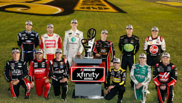 LAS VEGAS, NEVADA - SEPTEMBER 14: John Hunter Nemechek, driver of the #23 Berry's Manufacturing Chevrolet, Justin Allgaier, driver of the #7 BRANDT Professional Agriculture Chevrolet, Noah Gragson, driver of the #9 Switch Chevrolet, Brandon Jones, driver of the #19 Juniper Toyota, Justin Haley, driver of the #11 LeafFilter Gutter Protection Chevrolet, Cole Custer, driver of the #00 Haas Automation Ford, Chase Briscoe, driver of the #98 Ford Performance Ford, Michael Annett, driver of the #1 Pilot/Flying J Chevrolet, Austin Cindric, driver of the #22 MoneyLion Ford, Tyler Reddick, driver of the #2 TAME the BEAST Chevrolet, Ryan Sieg, driver of the #39 RSS Racing Chevrolet, Christopher Bell, driver of the #20 Rheem/Smurfit Kappa Toyota, pose for a photo as the 16 playoff contenders following the NASCAR Xfinity Series Rhino Pro Trucks Outfitters 300 at Las Vegas Motor Speedway on September 14, 2019 in Las Vegas, Nevada. (Photo by Jonathan Ferrey/Getty Images)