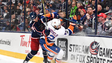 COLUMBUS, OH - DECEMBER 14: Boone Jenner #38 of the Columbus Blue Jackets checks Scott Mayfield #42 of the New York Islanders off the puck during the third period of a game on December 14, 2017 at Nationwide Arena in Columbus, Ohio. (Photo by Jamie Sabau/NHLI via Getty Images)