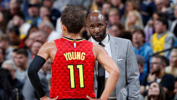 INDIANAPOLIS, IN - NOVEMBER 29: Head coach Lloyd Pierce of the Atlanta Hawks talks to Trae Young #11 during a game against the Indiana Pacers at Bankers Life Fieldhouse on November 29, 2019 in Indianapolis, Indiana. The Pacers defeated the Hawks 105-104 in overtime. (Photo by Joe Robbins/Getty Images) NOTE TO USER: User expressly acknowledges and agrees that, by downloading and or using this Photograph, user is consenting to the terms and conditions of the Getty Images License Agreement. (Photo by Joe Robbins/Getty Images)