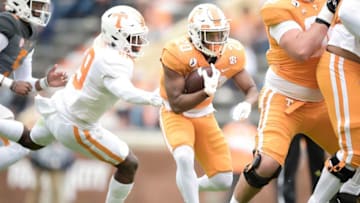 Tennessee running back Jabari Small (20) runs the ball as Tennessee linebacker Morven Joseph (19) defends at the Orange & White spring game at Neyland Stadium in Knoxville, Tenn. on Saturday, April 24, 2021.Kns Vols Spring Game