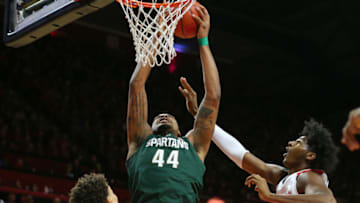 PISCATAWAY, NJ - NOVEMBER 30: Nick Ward #44 of the Michigan State Spartans attempts a shot as Caleb McConnell #22 and Eugene Omoruyi #5 of the Rutgers Scarlet Knights defend during the first half of a college basketball game at the Rutgers Athletic Center on November 30, 2018 in Piscataway, New Jersey. Michigan State defeated Rutgers 78-67. (Photo by Rich Schultz/Getty Images,)