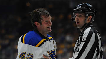 Feb 27, 2016; Nashville, TN, USA; St. Louis Blues center David Backes (42) is taken to the penalty box after a roughingcall during the second period against the Nashville Predators at Bridgestone Arena. Mandatory Credit: Christopher Hanewinckel-USA TODAY Sports