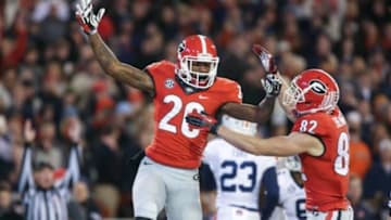 Nov 15, 2014; Athens, GA, USA; Georgia Bulldogs wide receiver Malcolm Mitchell (26) celebrates his touchdown catch with wide receiver Michael Bennett (82) in the first quarter of their game against the Auburn Tigers at Sanford Stadium. Mandatory Credit: Jason Getz-USA TODAY Sports