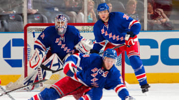 NEW YORK - SEPTEMBER 29: Michael Sauer #38, Ryan Callahan #24, and Henrik Lundqvist #30 of the New York Rangers protect the net against the Detroit Red Wings on September 29, 2010 at Madison Square Garden in New York City. The Rangers defeat the Red Wings 5-1. (Photo by Rebecca Taylor/MSG Photos/Getty Images)