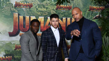 PARIS, FRANCE - DECEMBER 05: (L-R) Kevin Hart,Nick Jonas and Dwayne Johnson attend 'Jumanji : Welcome to the Jungle' Premiere at Le Grand Rex on December 5, 2017 in Paris, France. (Photo by Pascal Le Segretain/Getty Images)