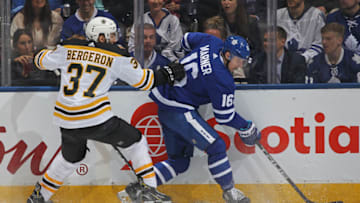 TORONTO, ON - APRIL 23: Patrice Bergeron #37 of the Boston Bruins skates against Mitchell Marner #16 of the Toronto Maple Leafs in Game Six of the Eastern Conference First Round in the 2018 Stanley Cup Play-offs at the Air Canada Centre on April 23, 2018 in Toronto, Ontario, Canada. The Maple Leafs defeated the Bruins 3-1.(Photo by Claus Andersen/Getty Images)