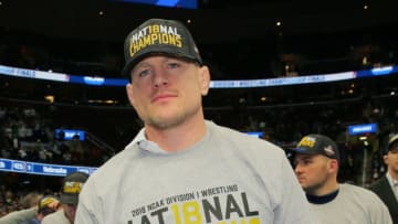 CLEVELAND, OH - MARCH 17: Head coach Cael Sanderson of the Penn State Nittany Lions wears team national champion apparel during the awards ceremony of the NCAA Photos via Getty Imagess via Getty Images Wrestling Championships on March 17, 2018 at QuickenLoans Arena in Cleveland, Ohio. (Photo by Hunter Martin/Getty Images) *** Local Caption *** Cael Sanderson