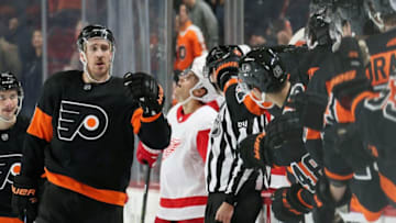 PHILADELPHIA, PA - NOVEMBER 29: Kevin Hayes #13 of the Philadelphia Flyers celebrates his third period goal against the Detroit Red Wings with his teammates on the bench on November 29, 2019 at the Wells Fargo Center in Philadelphia, Pennsylvania. (Photo by Len Redkoles/NHLI via Getty Images)