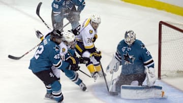 May 1, 2016; San Jose, CA, USA; Nashville Predators defenseman Roman Josi (59) and right wing Viktor Arvidsson (38) and San Jose Sharks right wing Joel Ward (42) fight for the puck in front of the goal in the second period in game two of the second round of the 2016 Stanley Cup Playoffs at SAP Center at San Jose. Mandatory Credit: Neville E. Guard-USA TODAY Sports