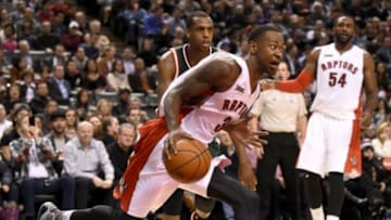 Feb 2, 2015; Toronto, Ontario, CAN; Toronto Raptors guard Terrence Ross (31) dribbles the ball in front of Raptors Patrick Paterson (54) and Milwaukee Bucks forward Khris Middleton (22) in the fourth quarter at Air Canada Centre.The Bucks won 82-75. Mandatory Credit: Dan Hamilton-USA TODAY Sports