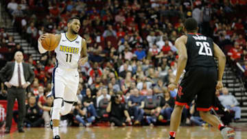 HOUSTON, TX - FEBRUARY 09: Monte Morris #11 of the Denver Nuggets brings the ball down the court defended by Markel Brown #26 of the Houston Rockets in the second half at Toyota Center on February 9, 2018 in Houston, Texas. NOTE TO USER: User expressly acknowledges and agrees that, by downloading and or using this Photograph, user is consenting to the terms and conditions of the Getty Images License Agreement. (Photo by Tim Warner/Getty Images)
