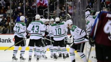 Feb 4, 2016; Denver, CO, USA; Dallas Stars defenseman John Klingberg (3) (middle) celebrates his winning goal in overtime against the Dallas Stars at the Pepsi Center. The Stars defeated the Avalanche in overtime 4-3. Mandatory Credit: Ron Chenoy-USA TODAY Sports
