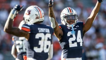 Auburn football players pump up the crowd during warm ups at Jordan-Hare Stadium in Auburn, Ala., on Saturday, Sept. 4, 2021.