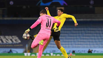 Jude Bellingham got the ball but his tackle was adjudged to be a foul by the referee (Photo by Michael Regan/Getty Images)