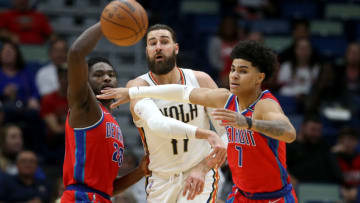 New Orleans Pelicans center Jonas Valanciunas (17) throws a pass while defended by Detroit Pistons center Isaiah Stewart (28) and guard Killian Hayes Credit: Chuck Cook-USA TODAY Sports