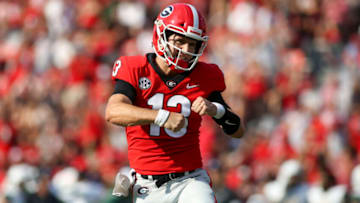 ATHENS, GA - SEPTEMBER 11: Stetson Bennett #13 of the Georgia Bulldogs celebrates after a touchdown throw against the UAB Blazers in the first half at Sanford Stadium on September 11, 2021 in Athens, Georgia. (Photo by Brett Davis/Getty Images)