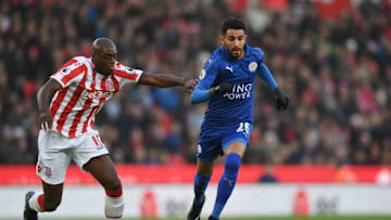 STOKE ON TRENT, ENGLAND - DECEMBER 17: Riyad Mahrez of Leicester City (R) takes the ball past Bruno Martins Indi of Stoke City (L) during the Premier League match between Stoke City and Leicester City at Bet365 Stadium on December 17, 2016 in Stoke on Trent, England. (Photo by Gareth Copley/Getty Images)