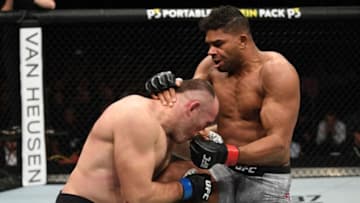 SAINT PETERSBURG, RUSSIA - APRIL 20: (R-L) Alistair Overeem of The Netherlands knees Aleksei Oleinik of Russia in their heavyweight bout during the UFC Fight Night event at Yubileyny Sports Palace on April 20, 2019 in Saint Petersburg, Russia. (Photo by Jeff Bottari/Zuffa LLC/Zuffa LLC via Getty Images)