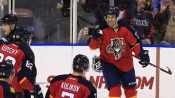 Dec 16, 2014; Sunrise, FL, USA; Florida Panthers center Derek MacKenzie (17) reacts after his goal against the Washington Capitals with teammates in the first period at BB&T Center. Mandatory Credit: Robert Mayer-USA TODAY Sports