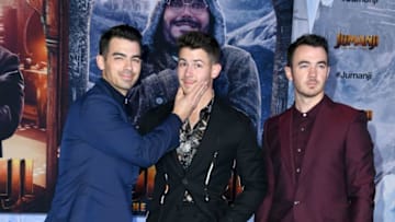 HOLLYWOOD, CALIFORNIA - DECEMBER 09: (L-R) Joe Jonas, Nick Jonas, and Kevin Jonas attend the premiere of Sony Pictures' "Jumanji: The Next Level" at TCL Chinese Theatre on December 09, 2019 in Hollywood, California. (Photo by Jon Kopaloff/Getty Images)