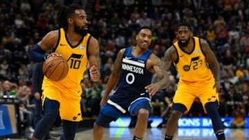 SALT LAKE CITY, UT - NOVEMBER 18: Mike Conley #10 of the Utah Jazz drives around Jeff Teague #0 of the Minnesota Timberwolves during a game at Vivint Smart Home Arena on November 18, 2019 in Salt Lake City, Utah. NOTE TO USER: User expressly acknowledges and agrees that, by downloading and/or using this photograph, user is consenting to the terms and conditions of the Getty Images License Agreement. (Photo by Alex Goodlett/Getty Images)