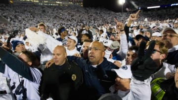 Oct 22, 2016; University Park, PA, USA; Penn State Nittany Lions head coach James Franklin (center) is surrounded by fans following the conclusion of the game against the Ohio State Buckeyes at Beaver Stadium. Penn State defeated Ohio State 24-21. Mandatory Credit: Matthew O