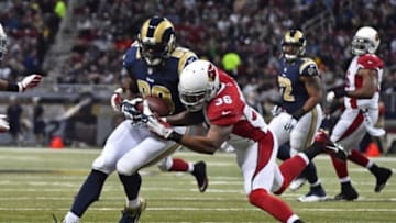 Dec 11, 2014; St. Louis, MO, USA; Arizona Cardinals strong safety Deone Bucannon (36) brings down St. Louis Rams tight end Jared Cook (89) during the first half at the Edward Jones Dome. Mandatory Credit: Jasen Vinlove-USA TODAY Sports