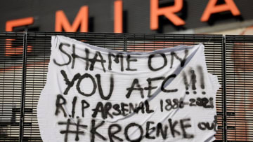 An anti-European Super League banner is pictured outside the Emirates Stadium, home of English Premier League football club Arsenal, in north London on April 19, 2021. - Twelve of Europe's biggest clubs on Monday said they planned to launch a breakaway Super League, despite the threat of an international ban for them and their players. "AC Milan, Arsenal, Atletico Madrid, Chelsea, Barcelona, Inter Milan, Juventus, Liverpool, Manchester City, Manchester United, Real Madrid and Tottenham Hotspur have all joined as founding clubs," said a statement by the group. (Photo by Tolga Akmen / AFP) (Photo by TOLGA AKMEN/AFP via Getty Images)