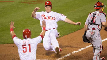 May 13, 2016; Philadelphia, PA, USA; Philadelphia Phillies catcher Carlos Ruiz (51) reacts as first baseman Tommy Joseph (19) scores past Cincinnati Reds catcher Tucker Barnhart (16) during the fourth inning at Citizens Bank Park. Mandatory Credit: Bill Streicher-USA TODAY Sports