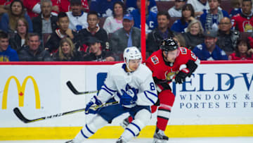OTTAWA, ON - OCTOBER 21: Toronto Maple Leafs Defenceman Connor Carrick (8) and Ottawa Senators Right Wing Mark Stone (61) battle for the puck along the boards during the NHL game between the Ottawa Senators and the Toronto Maple Leafs on October 21, 2017 at the Canadian Tire Centre in Ottawa, Ontario, Canada. (Photo by Steven Kingsman/Icon Sportswire via Getty Images)