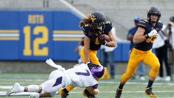 BERKELEY, CA - OCTOBER 27: Kanawai Noa #9 of the California Golden Bears is tackled by Taylor Rapp #7 of the Washington Huskies at California Memorial Stadium on October 27, 2018 in Berkeley, California. (Photo by Lachlan Cunningham/Getty Images)