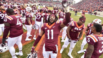BLACKSBURG, VA - NOVEMBER 18: Defensive end Houshun Gaines #11 of the Virginia Tech Hokies sings the fight song following the game against the Pittsburgh Panthers at Lane Stadium on November 18, 2017 in Blacksburg, Virginia. (Photo by Michael Shroyer/Getty Images)