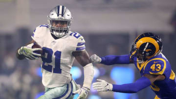 LOS ANGELES, CA - JANUARY 12: Ezekiel Elliott #21 of the Dallas Cowboys runs with the ball against John Johnson #43 of the Los Angeles Rams in the first half in the NFC Divisional Playoff game at Los Angeles Memorial Coliseum on January 12, 2019 in Los Angeles, California. (Photo by Sean M. Haffey/Getty Images)