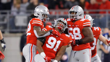 Sep 25, 2021; Columbus, Ohio, USA; Ohio State Buckeyes defensive tackle Tyleik Williams (91)celebrates his sack with defensive tackle Ty Hamilton (58)and linebacker Steele Chambers (22)during the fourth quarter at Ohio Stadium. Mandatory Credit: Joseph Maiorana-USA TODAY Sports