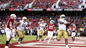 PALO ALTO, CALIFORNIA - NOVEMBER 30: Tony Jones Jr. #6 of the Notre Dame Fighting Irish runs the ball in for a touchdown against the Stanford Cardinal at Stanford Stadium on November 30, 2019 in Palo Alto, California. (Photo by Ezra Shaw/Getty Images)