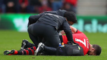 SOUTHAMPTON, ENGLAND - MARCH 09: Shane Long of Southampton is given treatment for an injury during the Premier League match between Southampton FC and Tottenham Hotspur at St Mary's Stadium on March 09, 2019 in Southampton, United Kingdom. (Photo by Catherine Ivill/Getty Images)