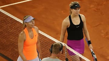 MADRID, SPAIN - MAY 08: Winner in three sets Eugenie Bouchard of Canada shakes hands with Maria Sharapova of Russia during day three of the Mutua Madrid Open tennis at La Caja Magica on May 8, 2017 in Madrid, Spain. (Photo by Julian Finney/Getty Images)