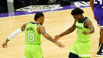 Anthony Edwards celebrates with D'Angelo Russell of the Minnesota Timberwolves. (Photo by Daniel Shirey/Getty Images)
